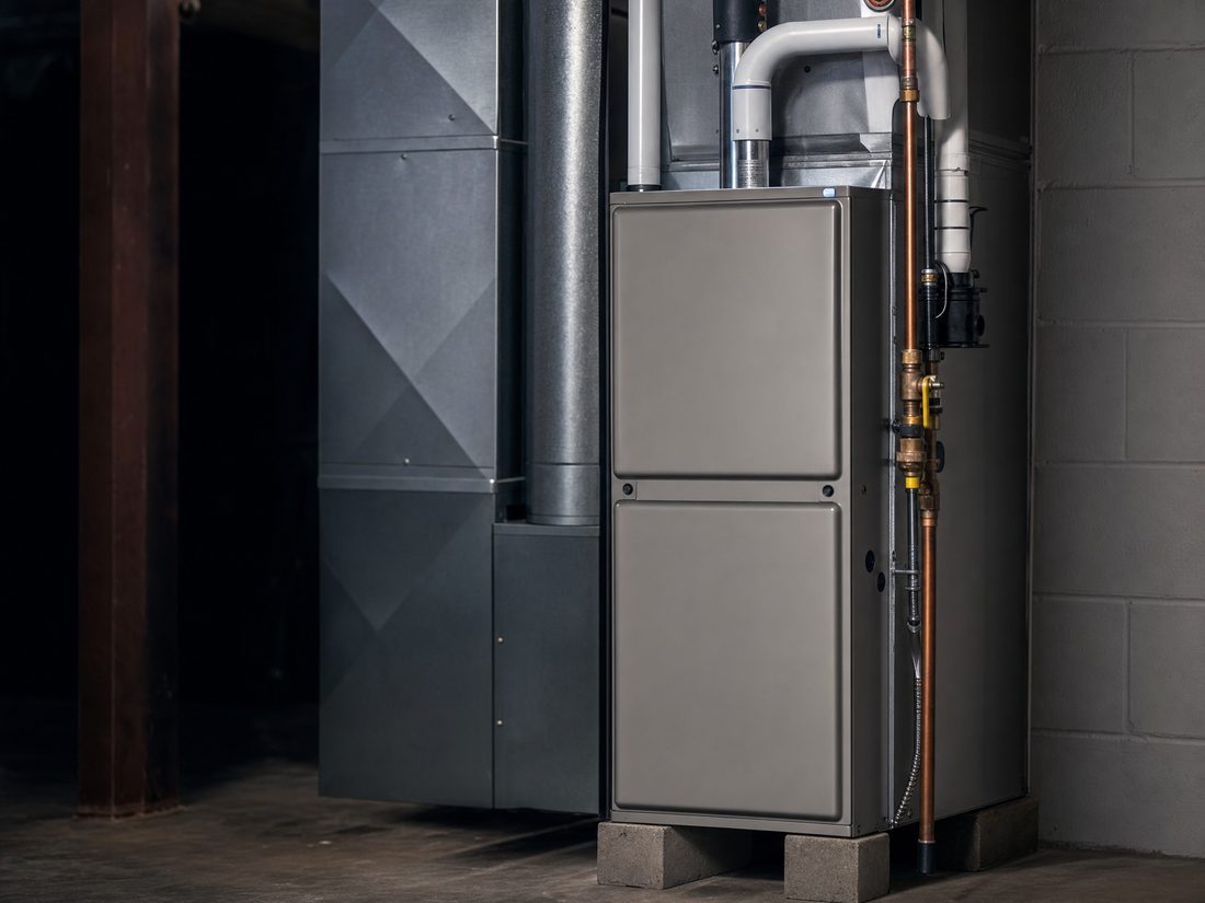 High-efficiency residential furnace installed in a clean utility room